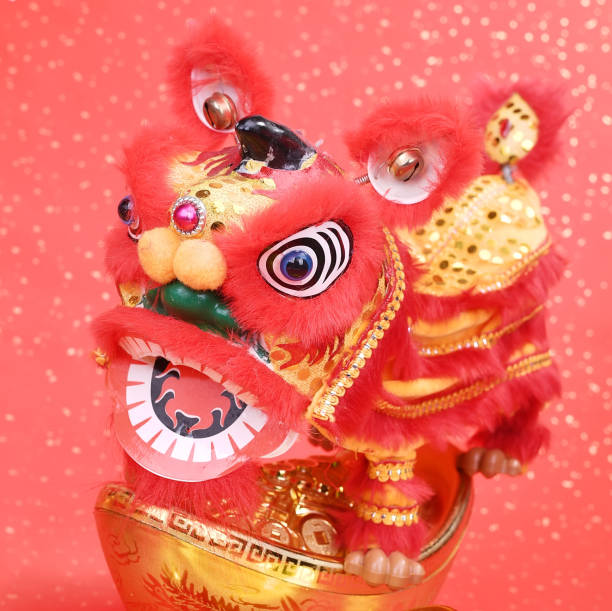 istock chinese traditional dancing lion with ingot 1091554662