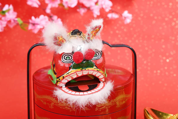 istock chinese traditional dancing lion with ingot 1091555780