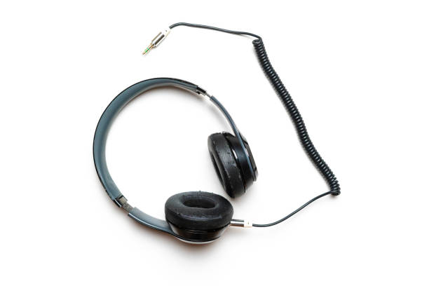 istock old used headphones isolated on white background 1091573948