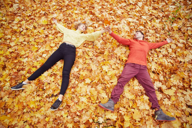 istock Young couple in love in autumn forest 1091576584