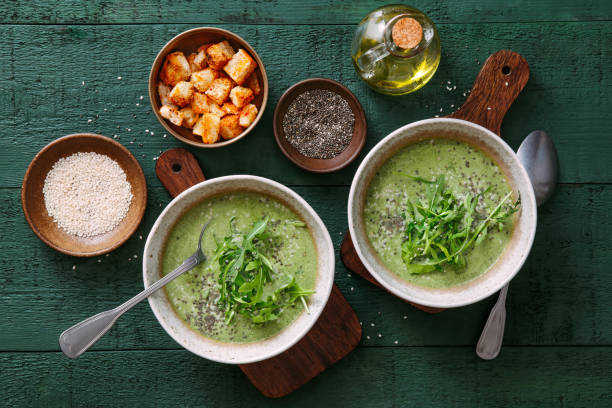 Vegetarian creamy spinach soup Vegetarian creamy spinach soup with chia seed and arugula arugula photos stock pictures, royalty-free photos & images