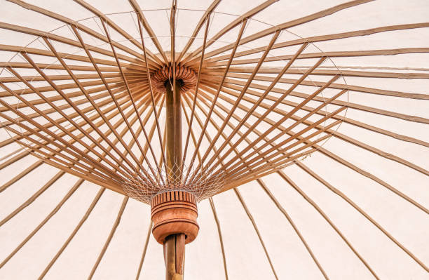 istock Close up colorful white umbrellas with bamboo structure patterns for background 1091586506