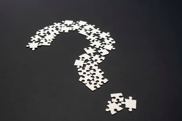 istock closeup puzze question mark on dark background isolated b 1091588184