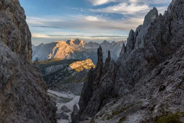 View from the pass Forcella della Neve (2,471 m) of the the Cadini group to the Marmarole range in the background at sunset (with the mountain Cimon del Froppa 2,932 m). It is located in the European Alps, Italy, Dolomites, Province of Belluno.