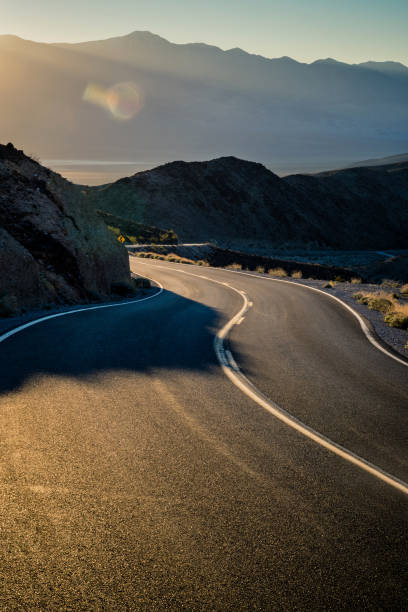istock Highway at sunrise, going into Death Valley National Park 1091590958