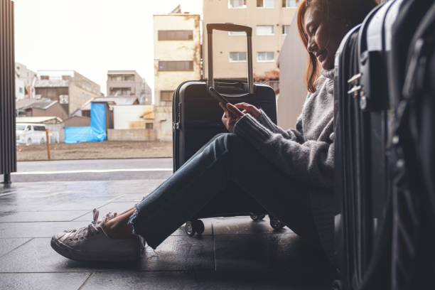 istock a woman sitting and using mobile phone 1091601442
