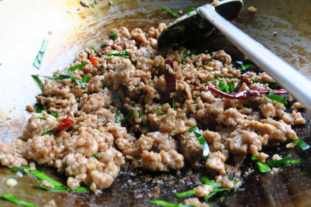 istock fried pork with herb leaf and chill, hot and spicy thai style 1091601836