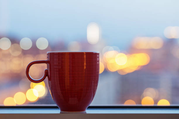 istock red cup on windowsill in city 1091613262
