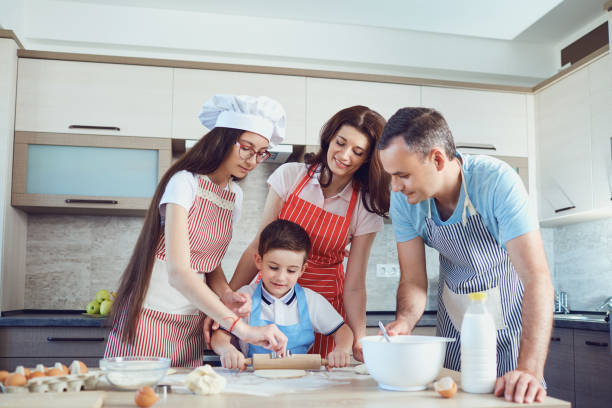 istock A happy family prepares baking in the kitchen 1091614178