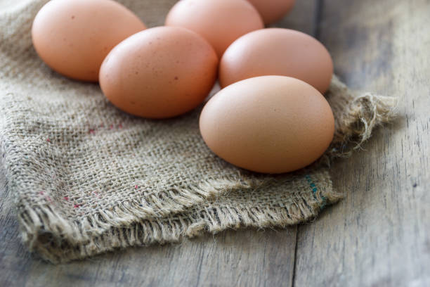 istock Fresh eggs on the wooden floor 1091618618