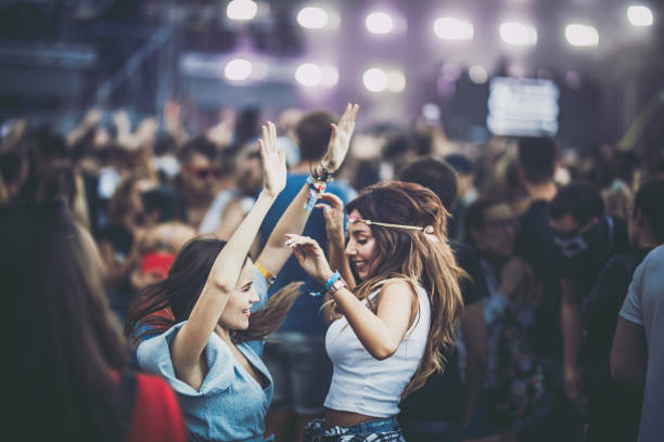 istock Happy women having fun while dancing on a music festival. 1091620538