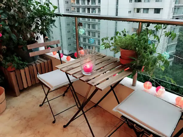 Decoration for terrace with plants, candle and furniture