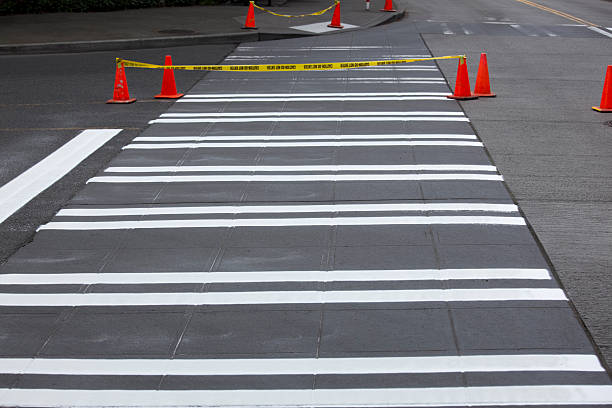 istock Road construction crew paints crosswalks on street 109162299