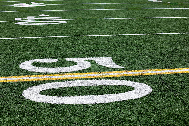 istock Football stadium 50 yard line artificial grass and markings 109162301