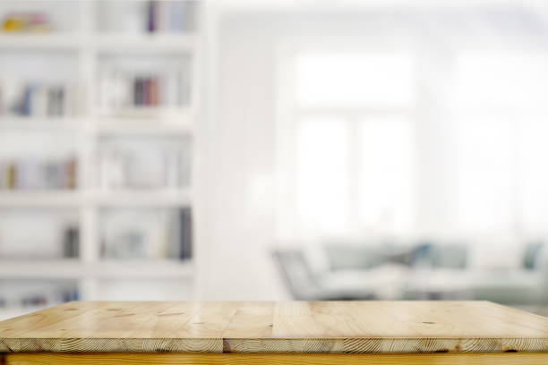 empty wooden desk table in living room background - living space imagens e fotografias de stock