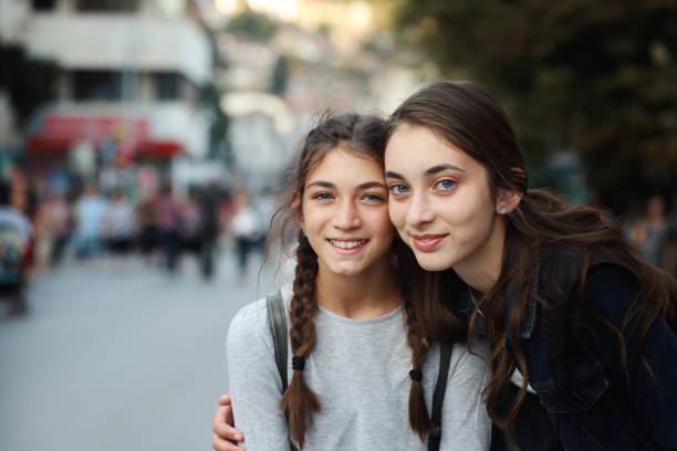 istock Two girls smiling to the camera 1091627304