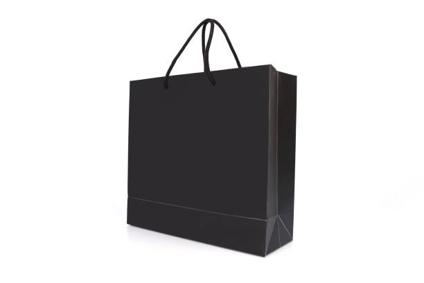 black paper bag with handles on a white background stock photo
