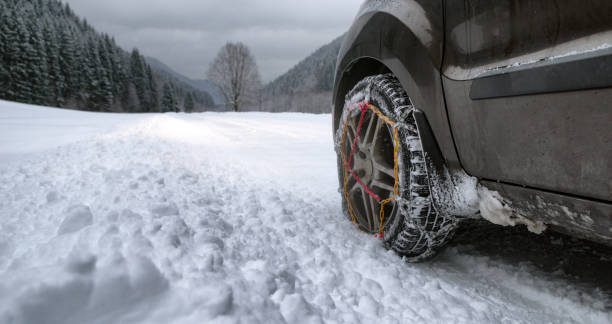 istock Snow chains on tire at winter road 1091642574