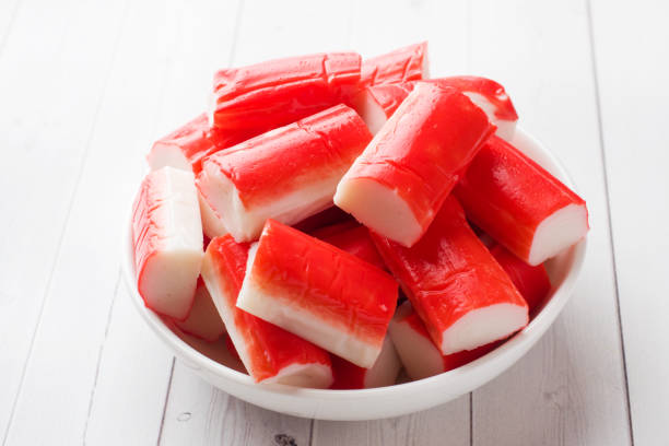 istock Salad crab sticks in a plate on a white table. 1091644452