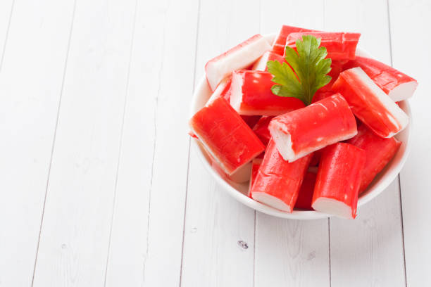 istock Salad crab sticks in a plate on a white table. Copy space 1091644518