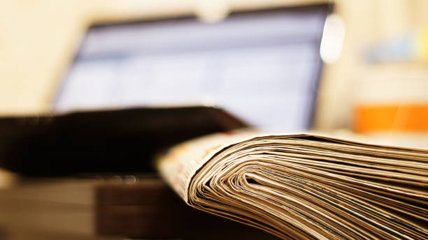 istock Newspapers and laptop 1091644720