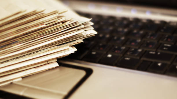istock Newspapers and laptop 1091645002