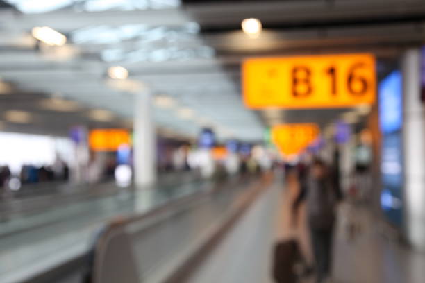 istock Defocused airport passengers crowd walking blurred people 1091646244