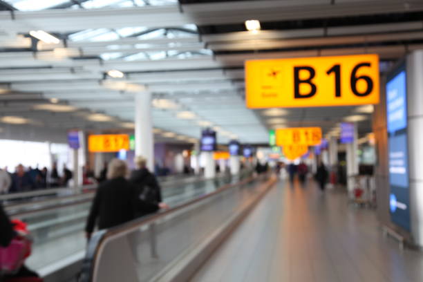 istock Defocused airport passengers crowd walking blurred people 1091646302