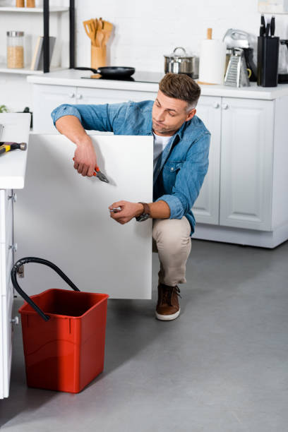 istock confused man repairing kitchen sink 1091647758