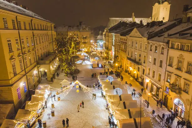 Photo of LVIV, UKRAINE - December 15, 2018: aerial view on christmas fest at square of old european city