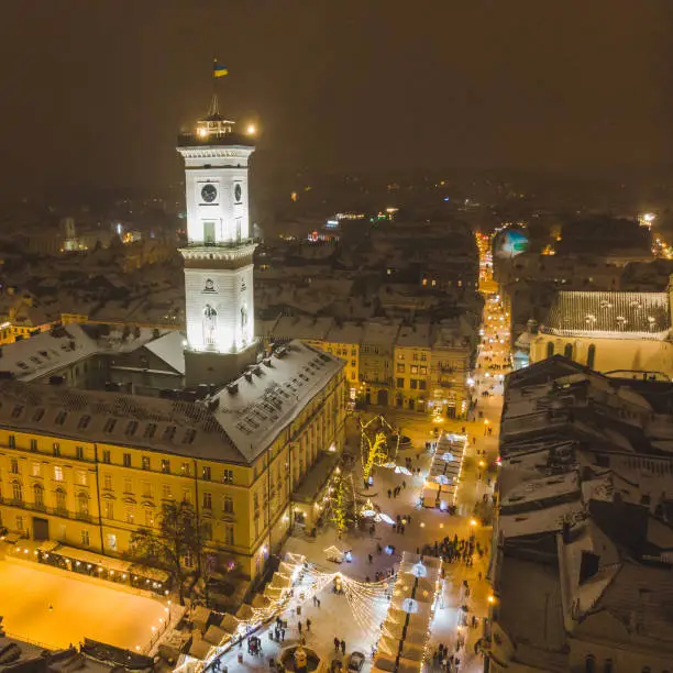 Photo of aerial view of capital building in center of european city at sunset in winter time