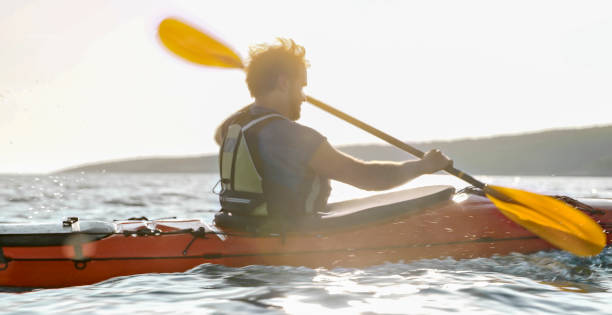 istock Kayaker rowing in sea 1091657380