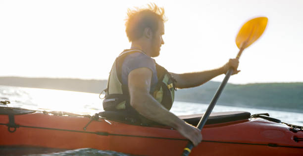 istock Kayaker rowing in sea 1091657382