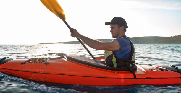 istock Kayaker rowing in sea 1091657408