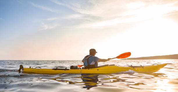 istock Kayaker rowing in sea 1091657410
