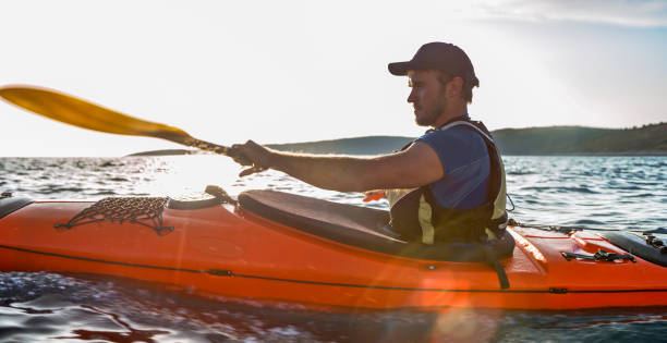 istock Kayaker rowing in sea 1091657414