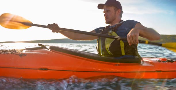 istock Kayaker rowing in sea 1091657418