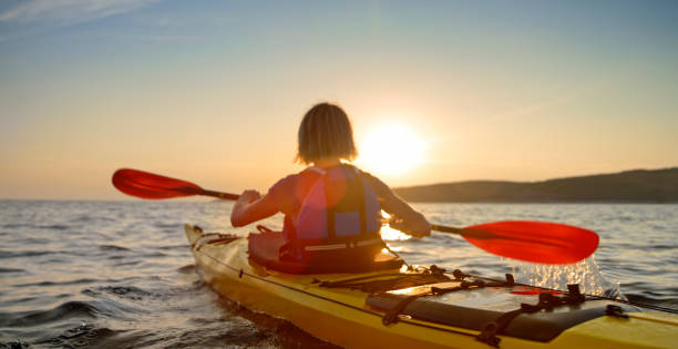 istock Kayaker rowing in sea 1091657432