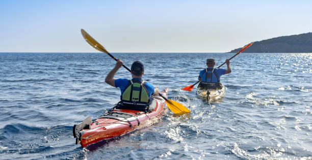 istock Kayakers rowing together in sea 1091657440