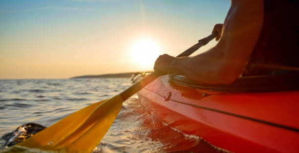 istock Kayaker rowing in sea 1091657444