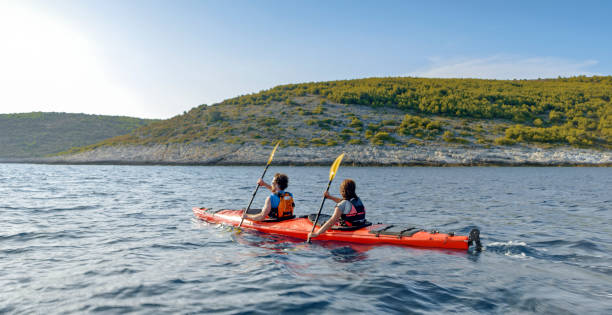 istock Kayaker rowing in sea 1091657450