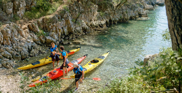 istock Two male kayakers shaking hands 1091657458
