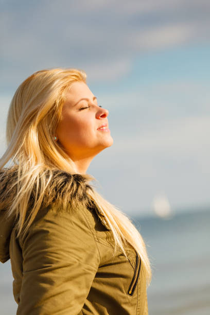 istock Woman relaxing outside on cold day 1091661792