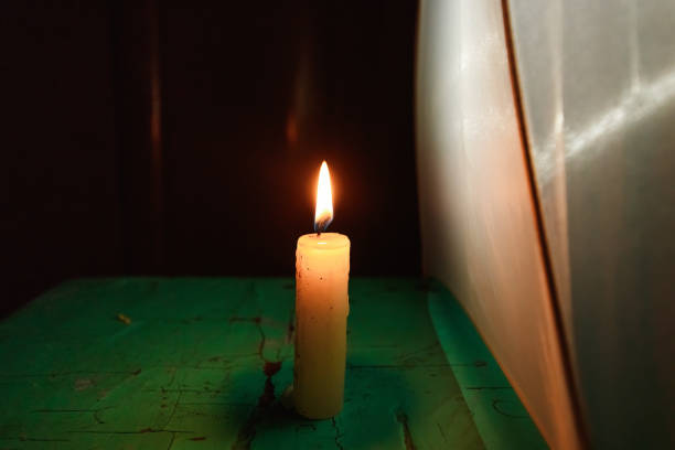 istock old candle on the black background 1091671182