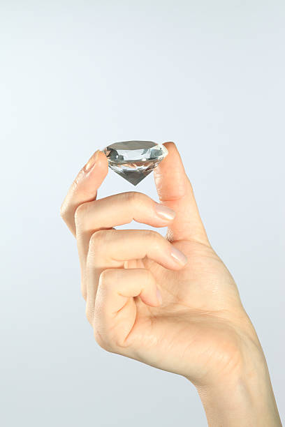 istock woman hand with diamond 109167268