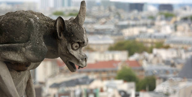 istock gargoyle on the cathedral of Notre Dame in Paris while observing 1091673620