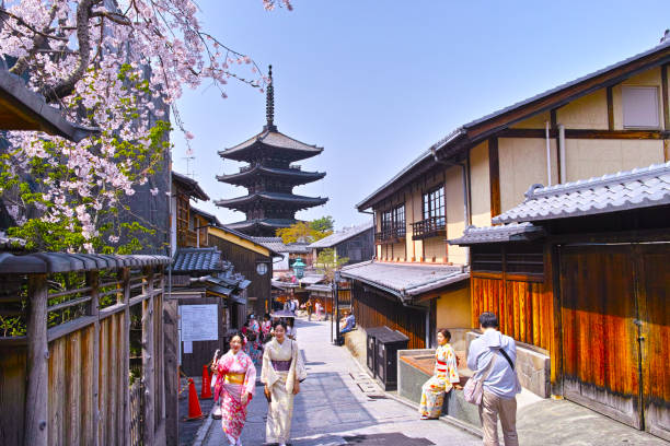 Kyoto, Japan-March 29, 2018: Tower of Yasaka in Higashiyama Ward, Kyoto City, Yasaka Street where cherry blossoms are in full bloom. Tourists in Kyoto can see many tourists walking on the rented Yukata.