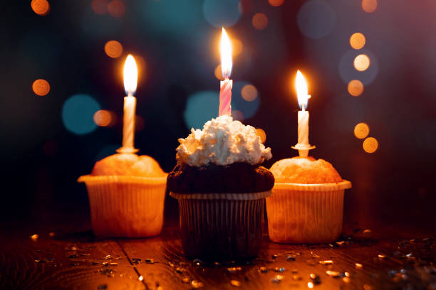 istock Creative background, cupcake with candles, beautiful bokeh. Happy Birthday. Present. Concept for Holiday Card, Flyer, Background. Copy space 1091683334