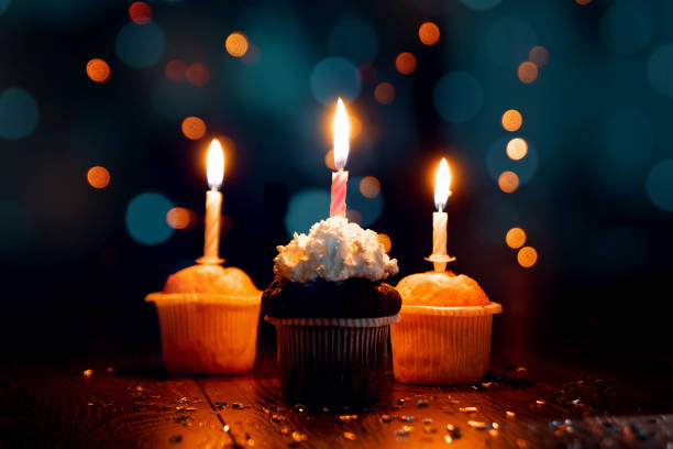 istock Creative background, cupcake with candles, beautiful bokeh. Happy Birthday. Present. Concept for Holiday Card, Flyer, Background. Copy space 1091683346