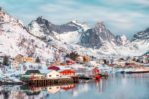 Colorful scandinavian village with snow mountain on coastline at Reine, Lofoten islands, Norway